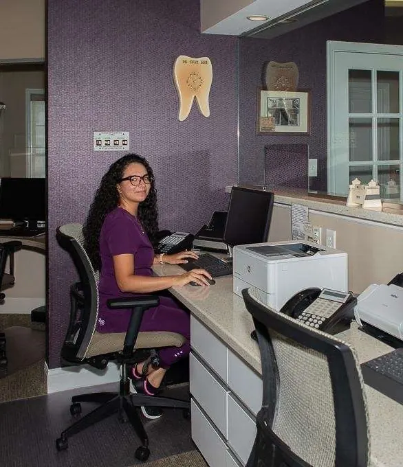 A team member at the front desk of Rehoboth Beach Dental.